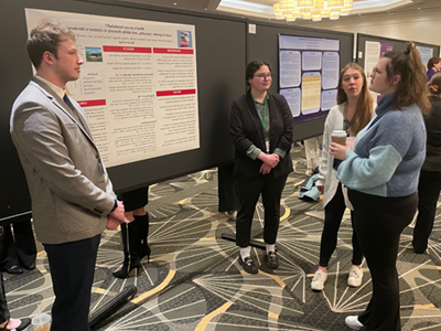 Image of student and faculty member presenting research at the Eastern Psychological Association.